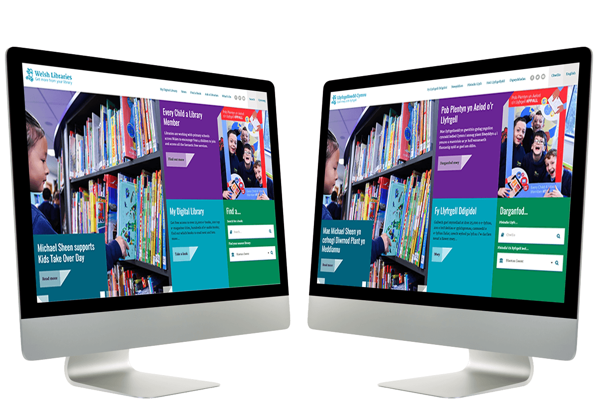 Two Mac computers displaying bilingual websites