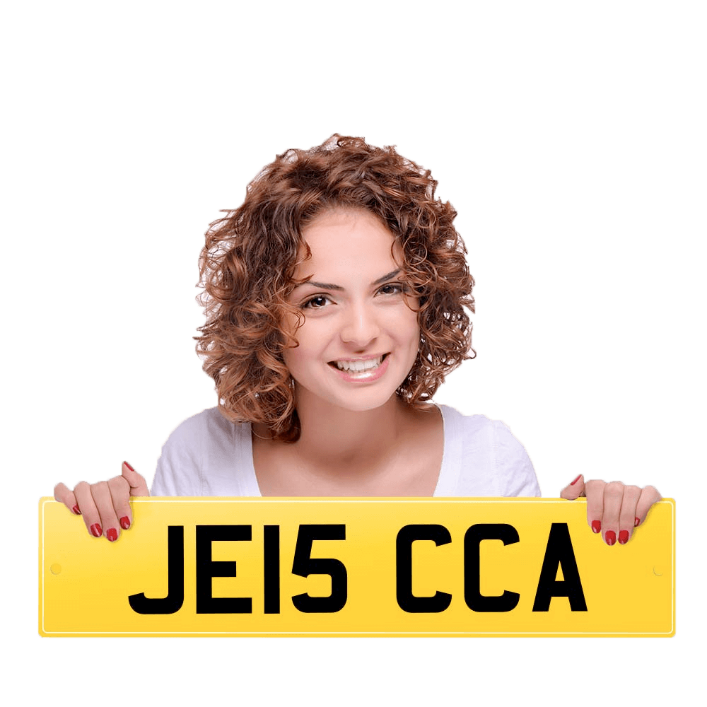 Young girl holding registration plate