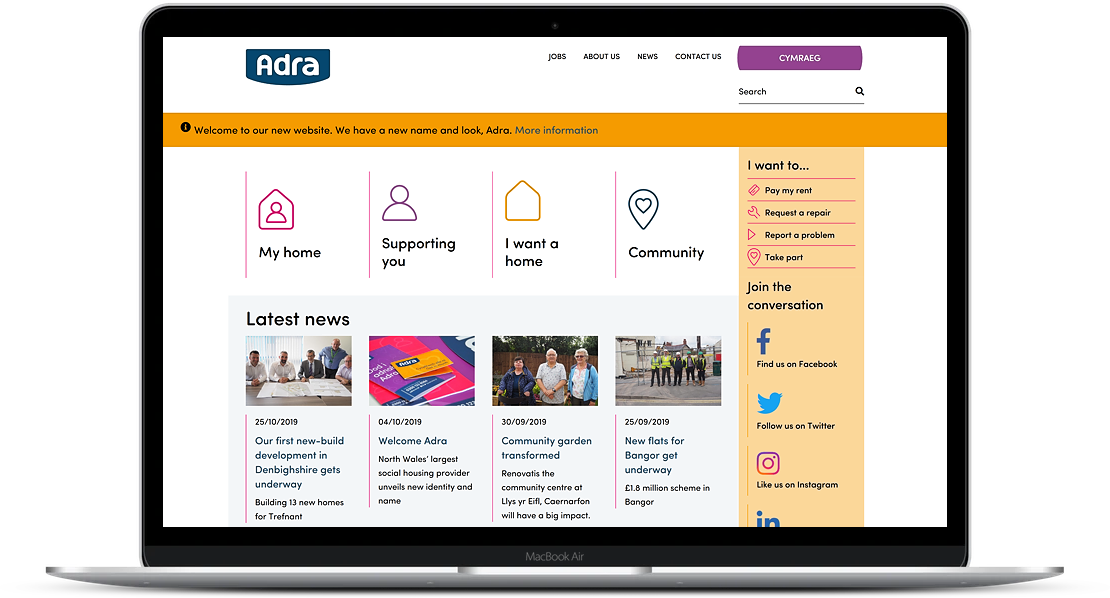 Adra website displayed on laptop